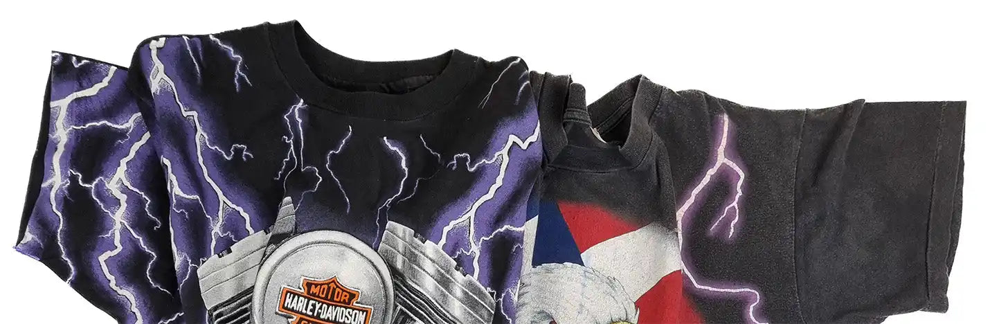 Black t-shirt with lightning bolts and Harley-Davidson motorcycle graphics.